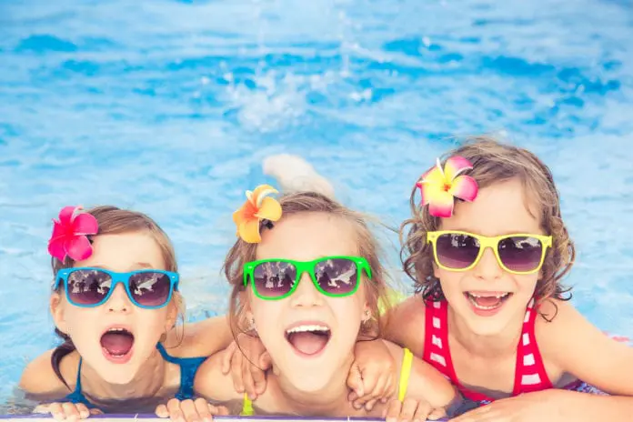 Happy children in the swimming pool