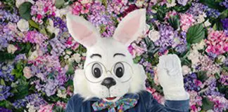 Large white Rabbit mascot sitting down at a McAllen Mall.